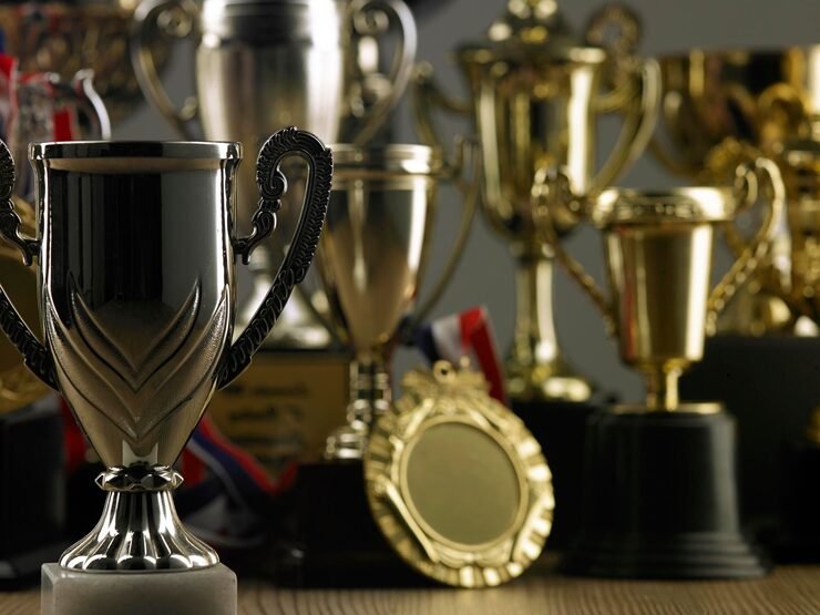 Group Trophies Wooden Table Gray Background 1048944 9280901